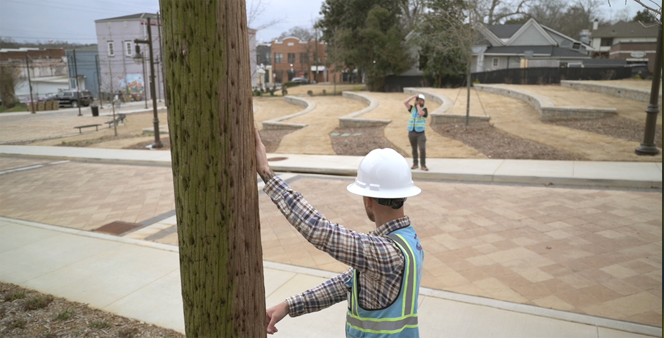 Fielder measuring a utility pole